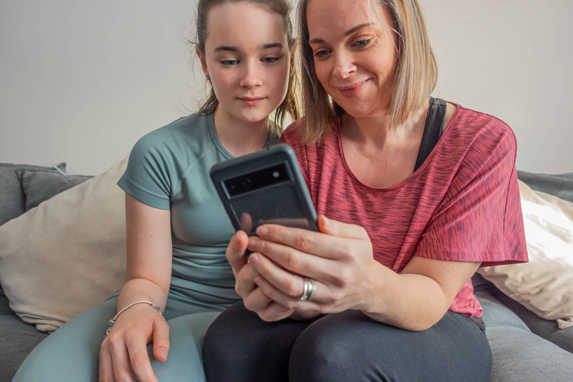 Mother and daughter planning fitness schedule